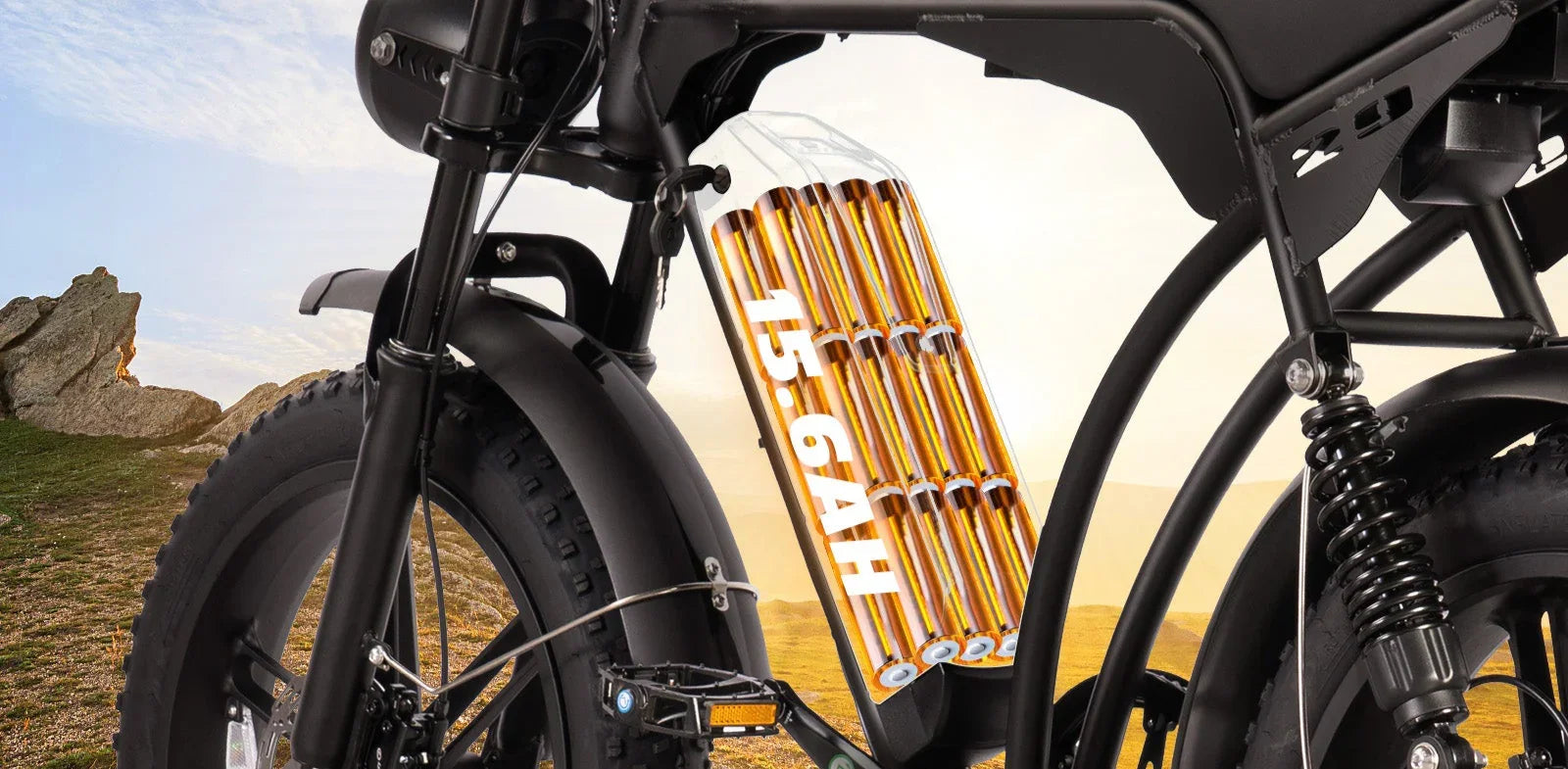 Close-up of electric bike battery labeled 15.6AH with fat tires and rear suspension outdoors
